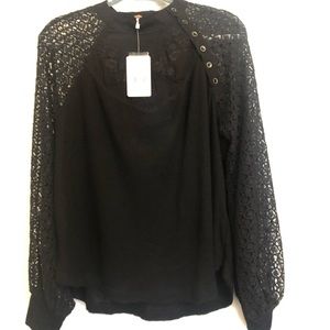 Free people black top with billowy sleeves.